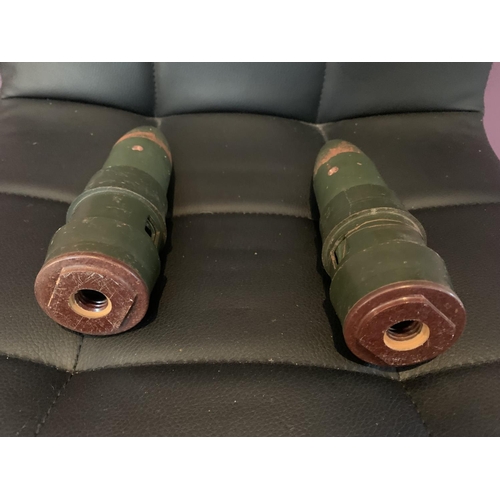 467 - A PAIR OF CANNON SHELLS