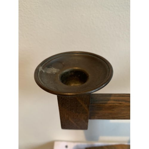 479 - AN OAK ARTS AND CRAFTS CANDLESTICK