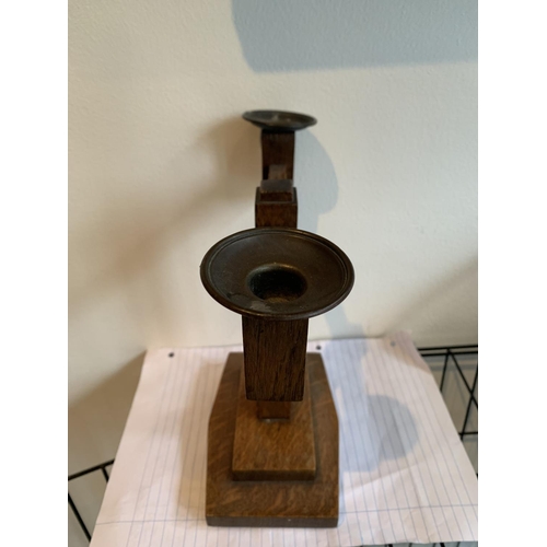 479 - AN OAK ARTS AND CRAFTS CANDLESTICK