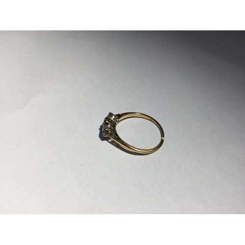 507 - AN 18 CARAT GOLD RING WITH THREE IN LINE DIAMONDS SIZE L/M (RING WORN THIN) GROSS WEIGHT 1.7 GRAMS