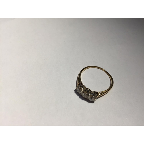 507 - AN 18 CARAT GOLD RING WITH THREE IN LINE DIAMONDS SIZE L/M (RING WORN THIN) GROSS WEIGHT 1.7 GRAMS