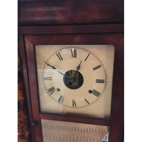 88A - A VINTAGE STYLE WOODEN CASED WALL CLOCK WITH COLUMNS AND FLORAL DECORATED FRONT, COMPLETE WITH PENDU... 