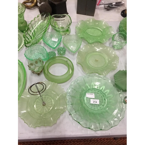 214 - A QUANITY OF GREEN GLASSWARE TO INCLUDE LEAF SHAPED BOWLS, PATTERNED PLATES, BOWLS, PLATES, ETC