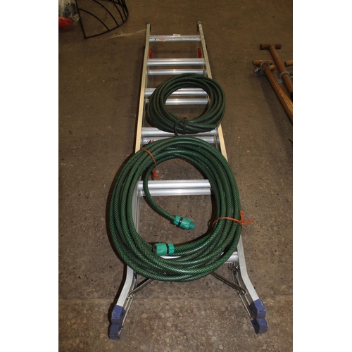 39 - A THREE WAY STEP LADDER AND TWO HOSE PIPES NO VAT