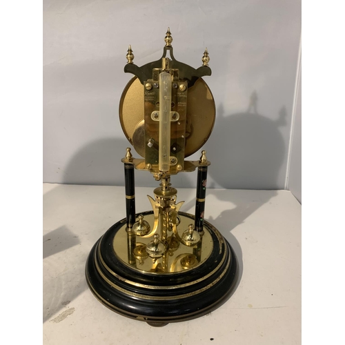 26 - AN ANNIVERSARY CLOCK WITH GLASS DOME AND FLORAL DECORATION