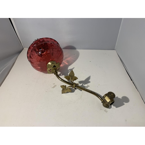 38 - A WALL MOUNTED CRANBERRY GLASS OIL LAMP