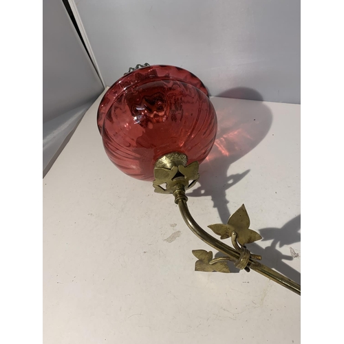 38 - A WALL MOUNTED CRANBERRY GLASS OIL LAMP