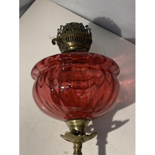 38 - A WALL MOUNTED CRANBERRY GLASS OIL LAMP