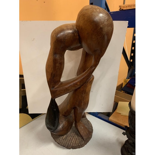 48 - A LARGE WOODEN CARVED FIGURE HEIGHT APPROXIMATELY 66CM