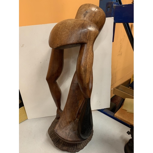 48 - A LARGE WOODEN CARVED FIGURE HEIGHT APPROXIMATELY 66CM