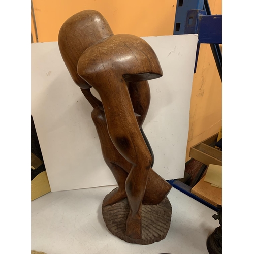 48 - A LARGE WOODEN CARVED FIGURE HEIGHT APPROXIMATELY 66CM