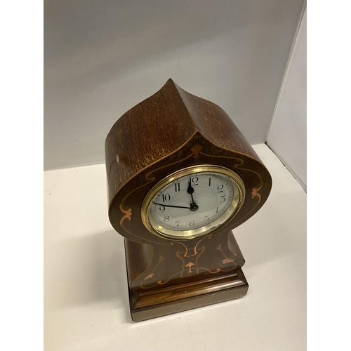 84 - AN ART NOUVEAU STYLE MANTLE CLOCK WITH COPPER INLAY