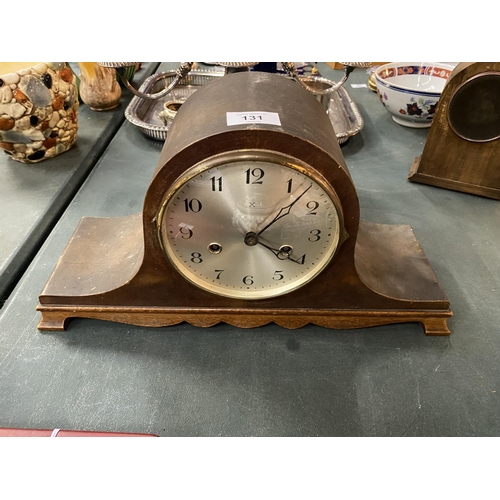 131 - A NAPOLEONS HAT MAHOGANY CASED MANTLE CLOCK- WORKING AT TIME OF CATALOGING