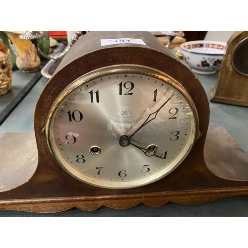 131 - A NAPOLEONS HAT MAHOGANY CASED MANTLE CLOCK- WORKING AT TIME OF CATALOGING