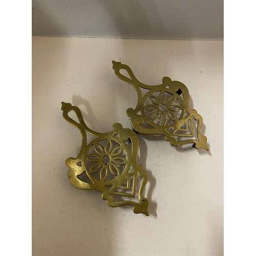 147 - TWO BRASS TRIVETS LENGTH 25CM