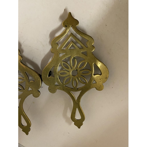 147 - TWO BRASS TRIVETS LENGTH 25CM