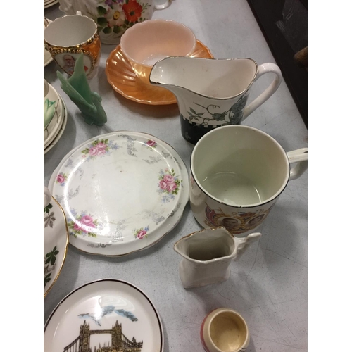 261 - A NUMBER OF CERAMIC MUGS, SOUP DISHES AND A TEAPOT