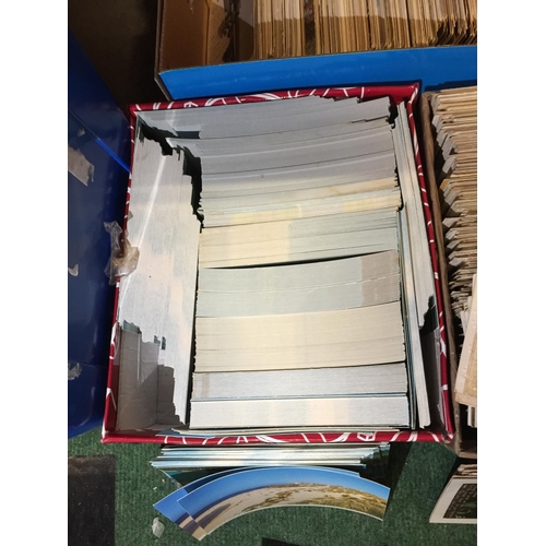 412 - A LARGE COLLECTION OF VINTAGE POSTCARDS IN THREE BOXES TO INCLUDE A LARGE AMOUNT WITH A BORDERED FLO... 