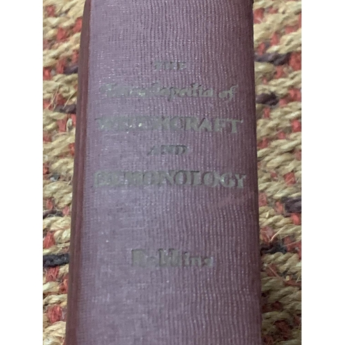 421 - A HARDBACK SECOND IMPRESSION OF 'THE ENCYCLOPEDIA OF WITCHCRAFT AND DEMONOLOGY BY ROSSELL HOPE ROBBI... 