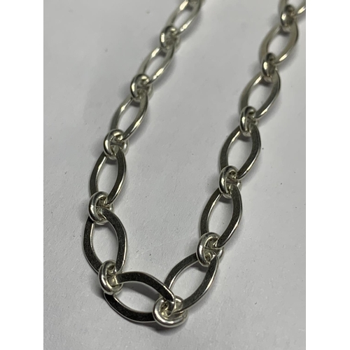 525 - FOUR MARKED SILVER NECKLACES TO INCLUDE A BONE, TWO LOCKETS AND A LINK CHAIN