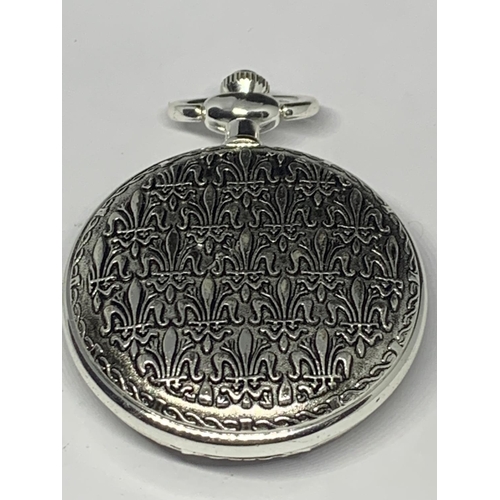 538 - A WHITE METAL RISING MOON POCKET WATCH SEEN WORKING BUT NO WARRANTY