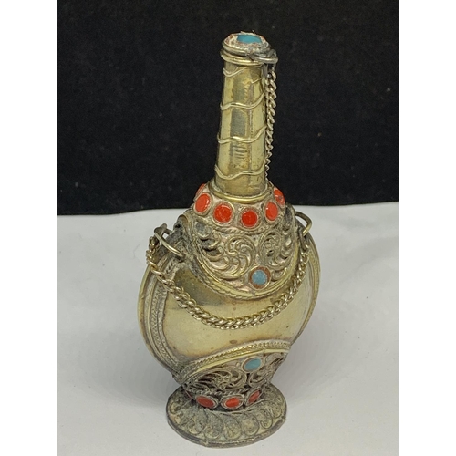 564 - AN ORNATE WHITE METAL ASIAN PERFUME BOTTLE