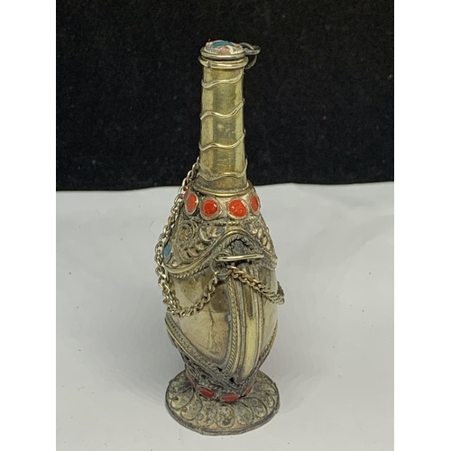 564 - AN ORNATE WHITE METAL ASIAN PERFUME BOTTLE