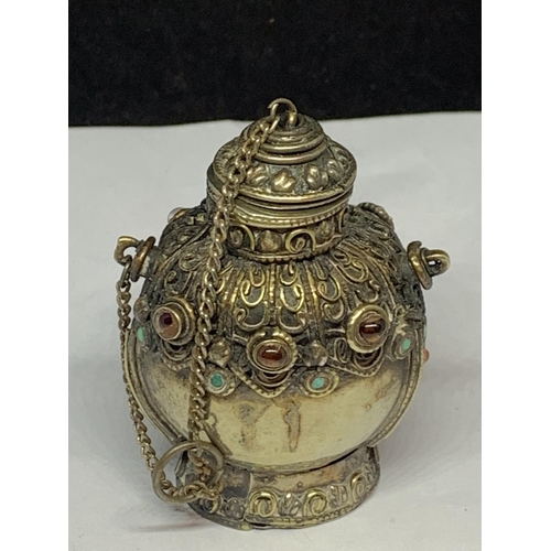 565 - A DECORATIVE WHITE METAL ASIAN PERFUME BOTTLE