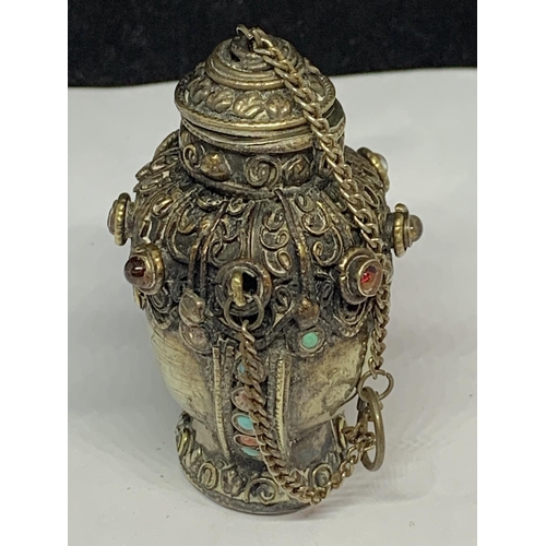 565 - A DECORATIVE WHITE METAL ASIAN PERFUME BOTTLE