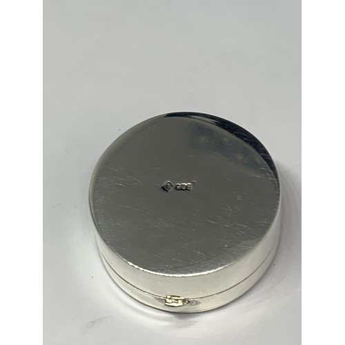 585 - A MARKED SILVER PILL BOX EMBOSSED WITH A RETRIEVER