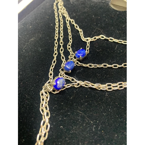 603 - A MARKED SILVER PART NECKLACE WITH BLUE STONE DESIGN