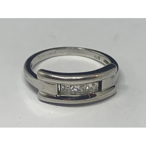 639 - A 9 CARAT WHITE GOLD RING WITH THREE IN LINE CLEAR STONES GROSS WEIGHT 3.2 GRAMS SIZE M