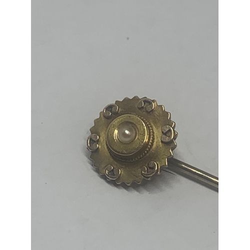 648 - A VICTORIAN 15 CARAT GOLD SEED PEARL STICK PIN GROSS WEIGHT 2 GRAMS IN A PRESENTATION  BOX