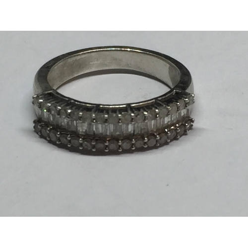 696 - A SILVER RING WITH CLEAR STONE CHIPS