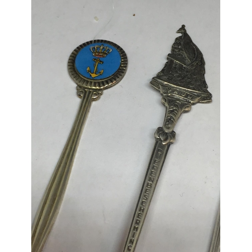 699 - SIX ORNATE COLLECTORS SPOONS