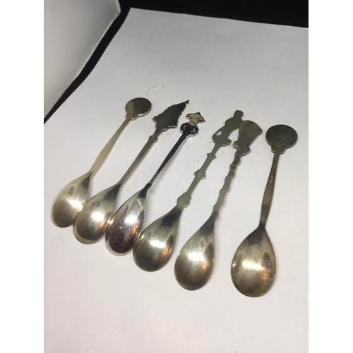 699 - SIX ORNATE COLLECTORS SPOONS