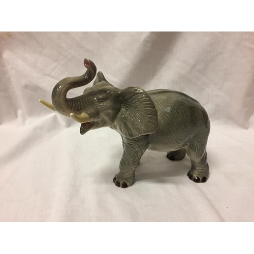 722 - A CERAMIC ELEPHANT