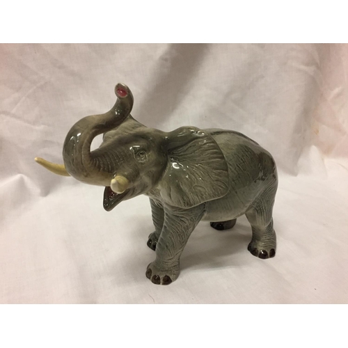 722 - A CERAMIC ELEPHANT