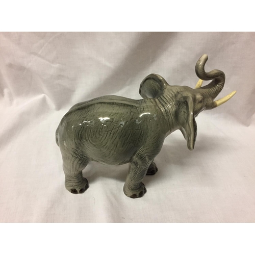 722 - A CERAMIC ELEPHANT