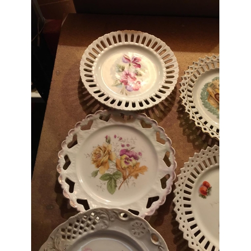 805 - SEVEN CABINET RIBBON PLATES (NO RIBBON) WITH FLORAL DECORATION