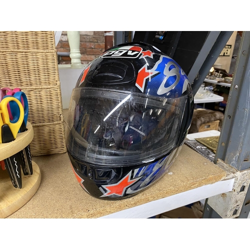 844 - A BLACK, RED, AND BLUE AGV MOTORBIKE HELMET