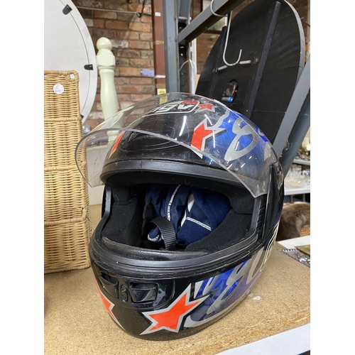 844 - A BLACK, RED, AND BLUE AGV MOTORBIKE HELMET