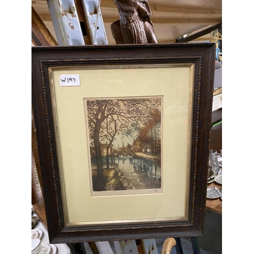 956 - TWO FRAMED PRINTS, ONE SIGNED WITH A CANAL SCENE AND THE OTHER A RURAL STREET SCENE