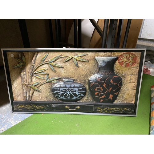 978 - A FRAMED 3D PICTURE OF BAMBOO AND POTS ON A TABLE