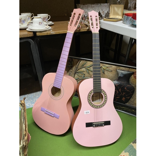 1014 - TWO PINK ACCOUSTIC GUITARS