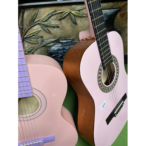 1014 - TWO PINK ACCOUSTIC GUITARS