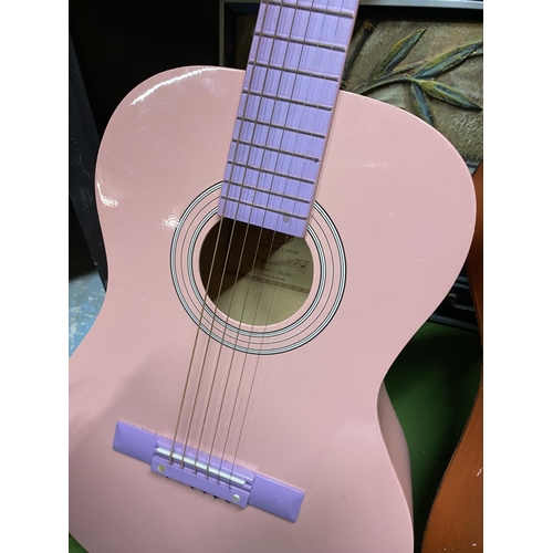 1014 - TWO PINK ACCOUSTIC GUITARS