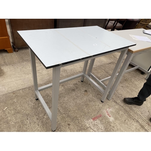 1736 - A METAL FRAMED WORK TABLE 39