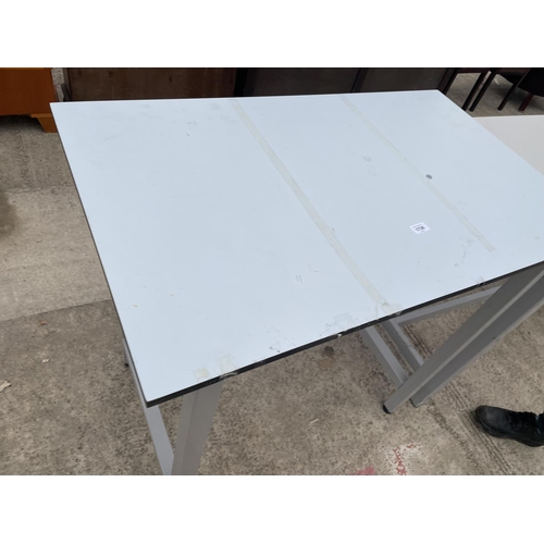 1736 - A METAL FRAMED WORK TABLE 39