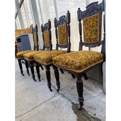 2012 - A SET OF FOUR LATE VICTORIAN SPRUNG AND UPHOLSTERED DINING CHAIRS WITH CARVED FOLIATE TOP RAIL, ON T... 